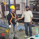 Safety champion at work — full PPE and 100% tie-off in practice